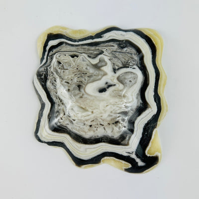 bottom side of Mexican onyx bowl on white background