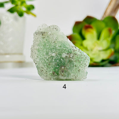 variant 4 of fluorite with pyrite and crystal quartz growth with decorations in the background