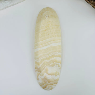 bottom side of Mexican onyx long bowl on white background