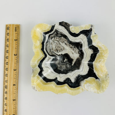 Mexican onyx bowl next to a ruler for size reference