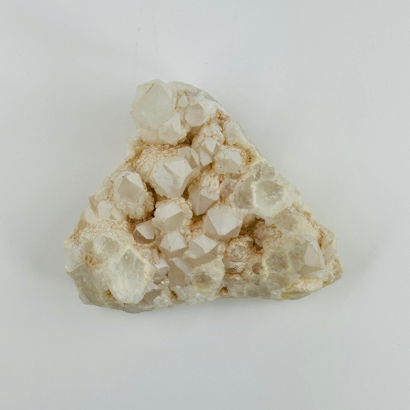 Top view of calcite cluster on white background