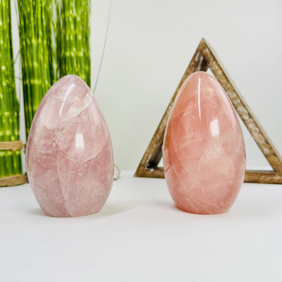 rose quartz polished cutbases with decorations in the background