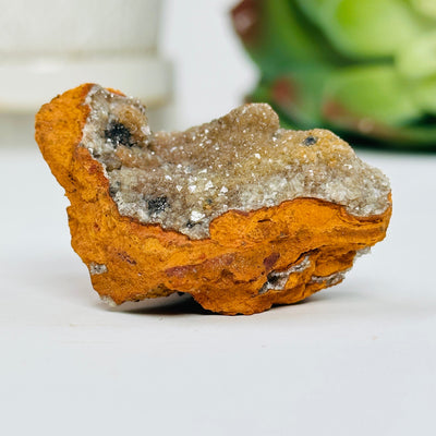 Hemimorphite cluster with decorations in the background
