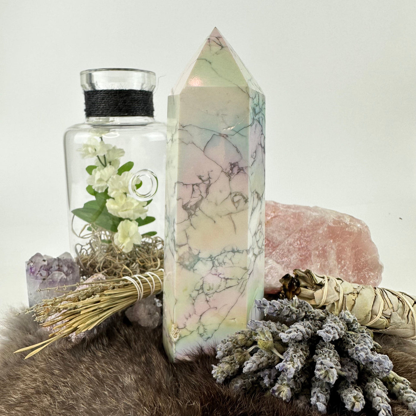 White howlite aura tower surrounded by decorations