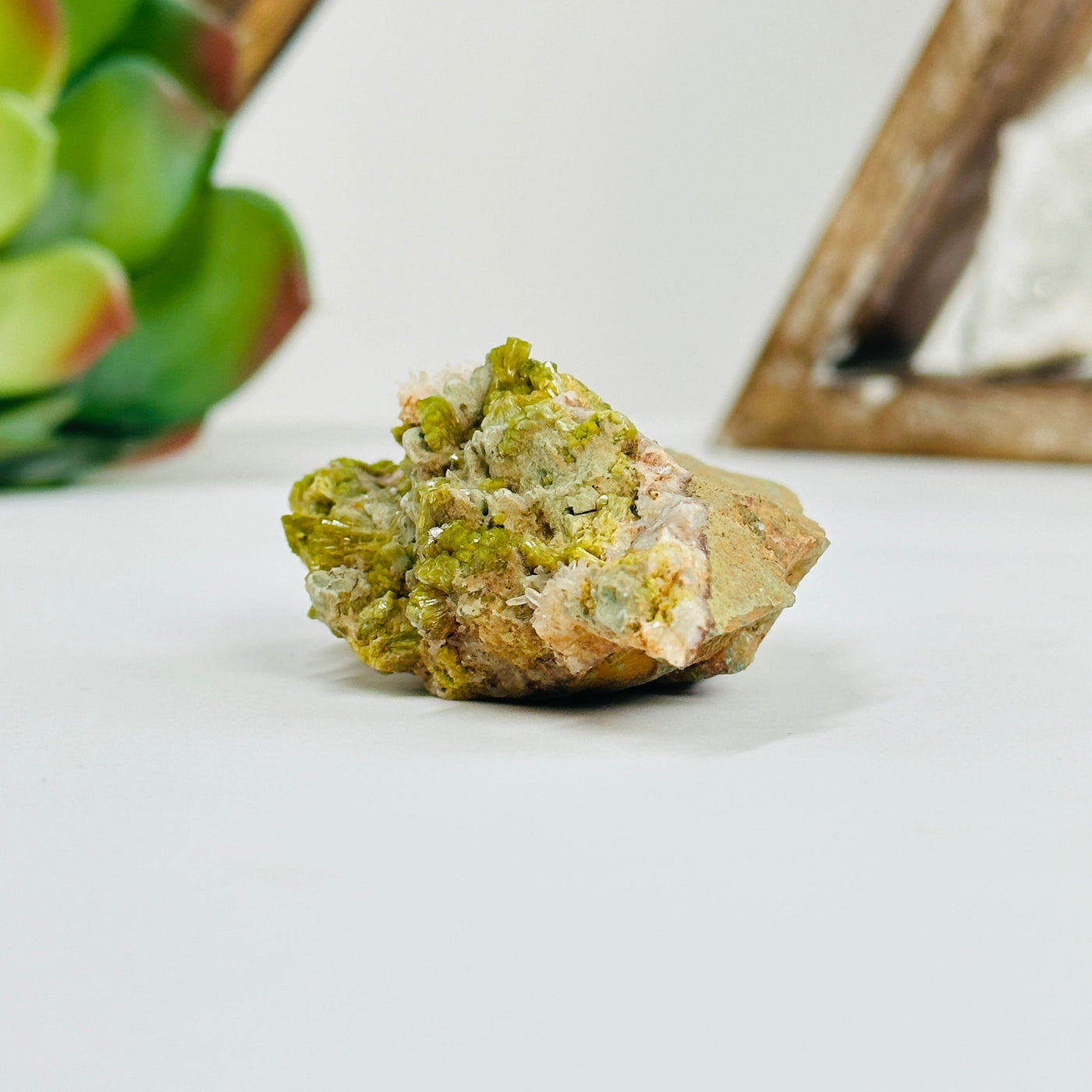 pyromorphite cluster with decorations in the background