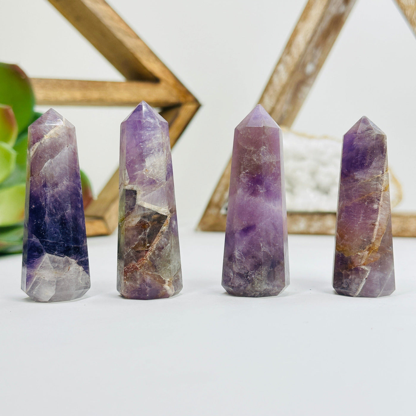 amethyst obelisk points with decorations in the background