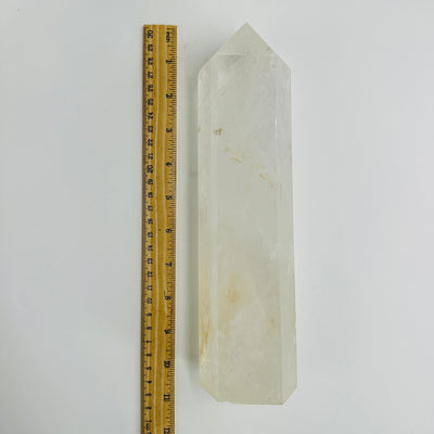 Crystal Quartz tower next to a ruler for size reference