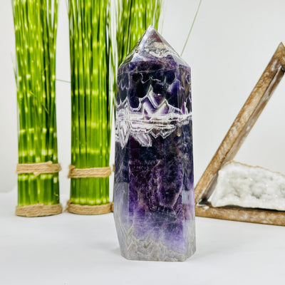 chevron amethyst polished tower with decorations in the background