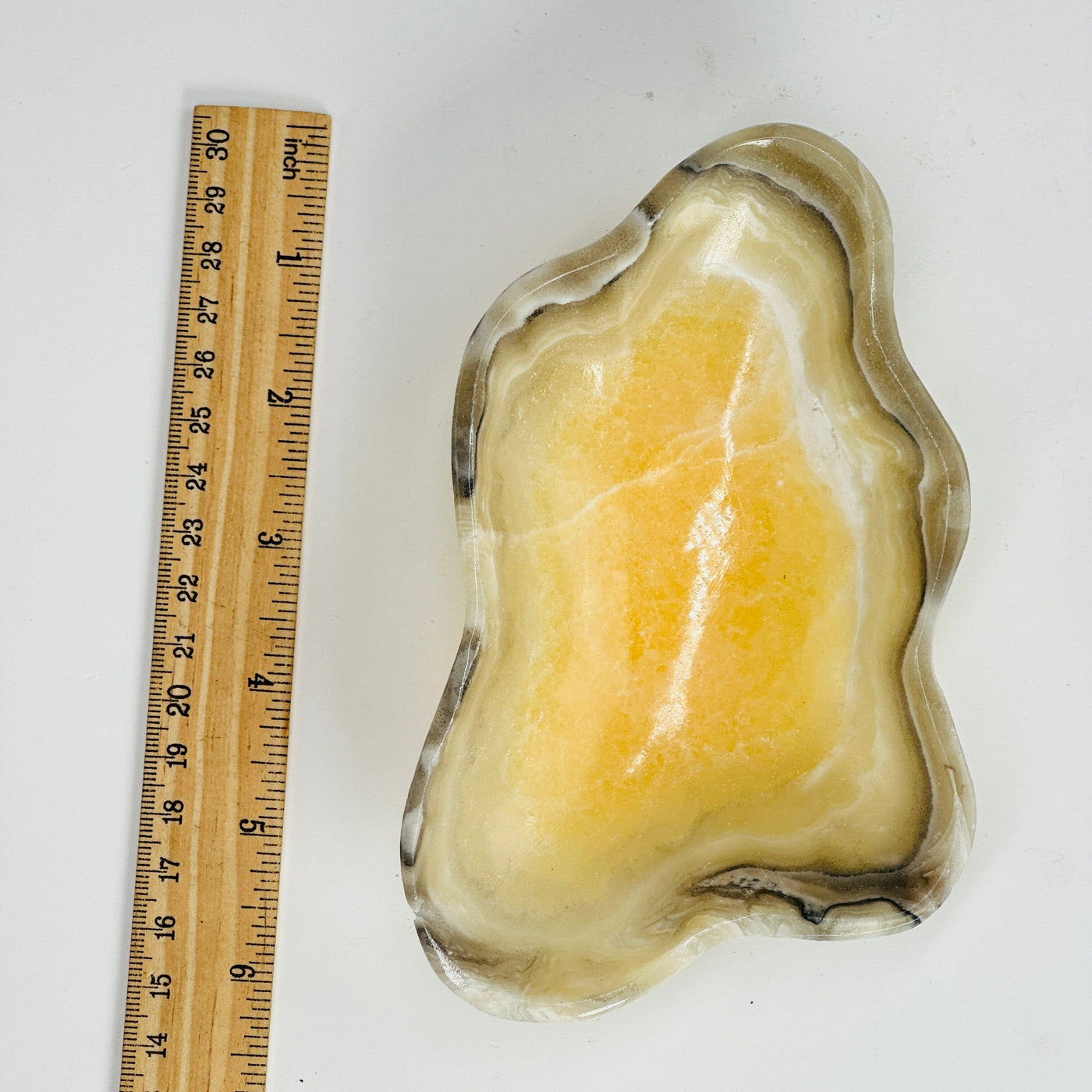 Mexican onyx bowl next to a ruler for size reference