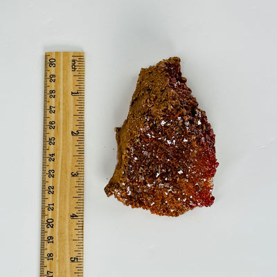 vanadinite next to a ruler for size reference