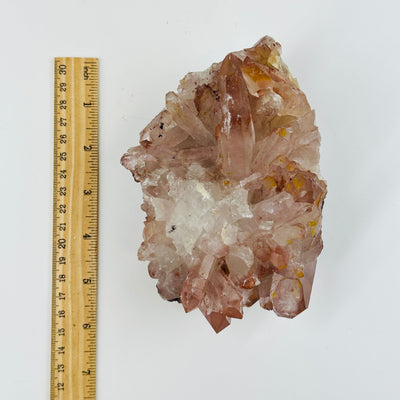 lithium quartz freeform next to a ruler for size reference