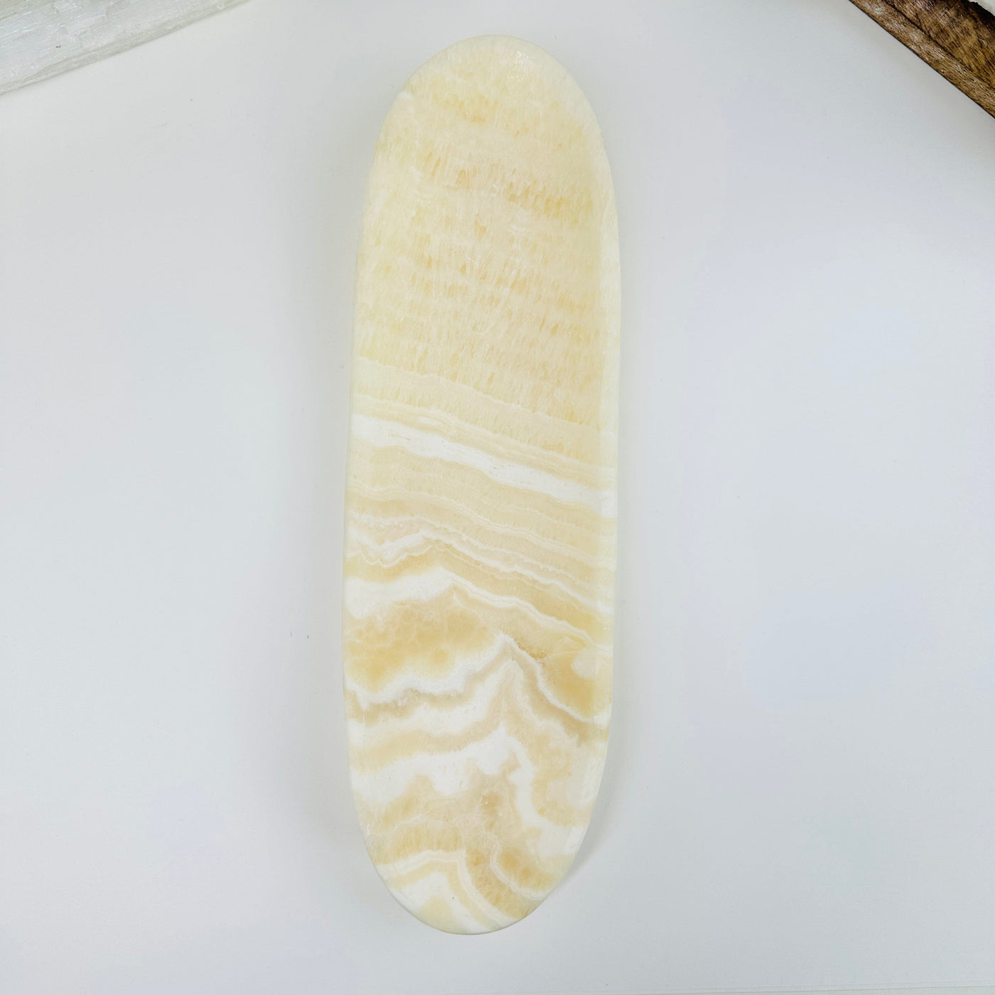 top view of Mexican onyx long bowl on white background