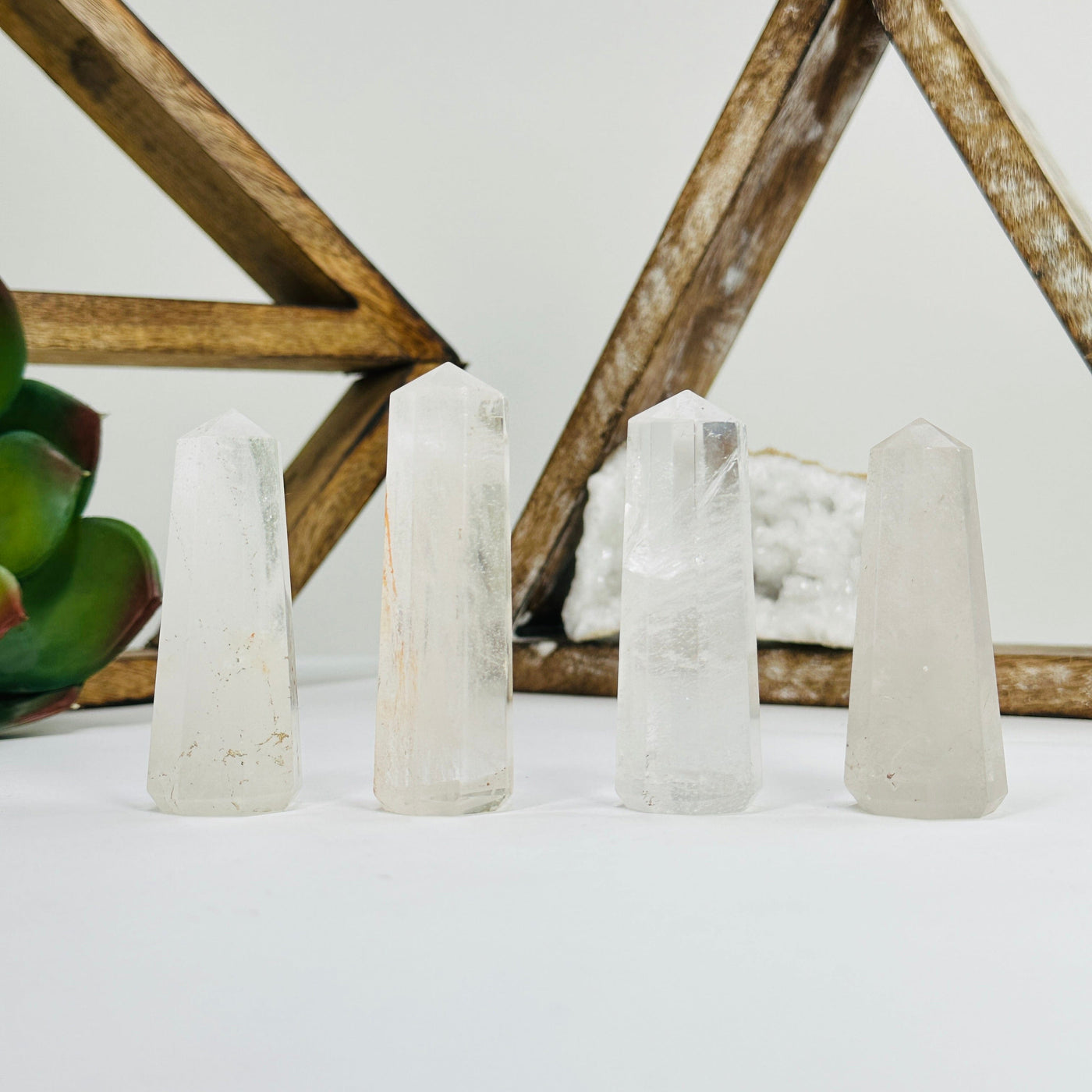 crystal quartz obelisks with decorations in the background