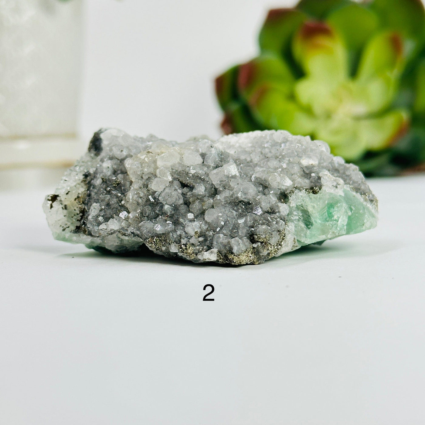 variant 2 of fluorite with pyrite and crystal quartz growth with decorations in the background