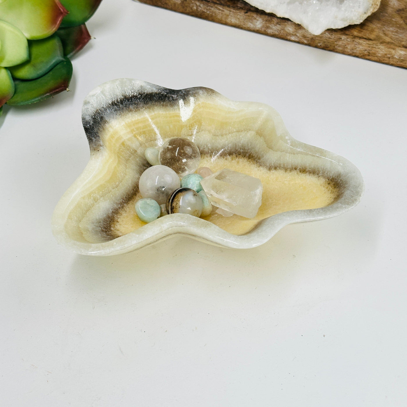 Mexican onyx bowl with decorations in the background