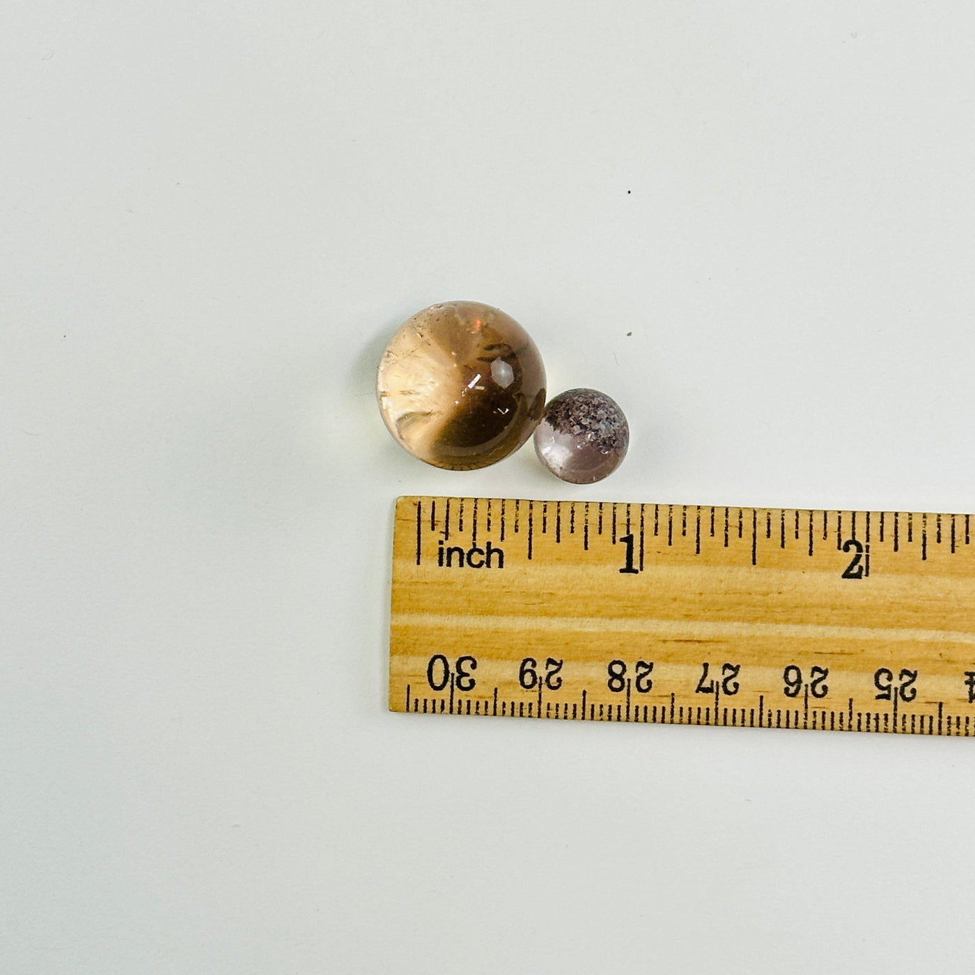 lodalite spheres next to a ruler for size reference