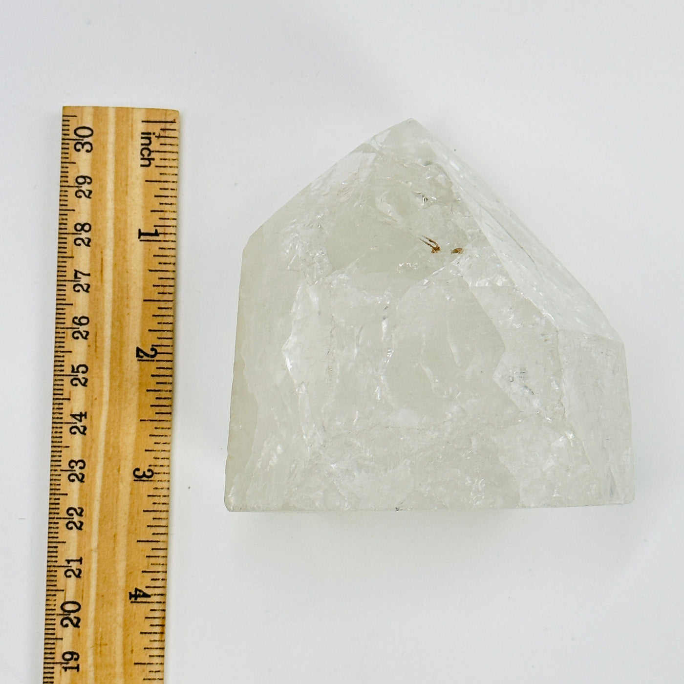 crackle quartz next to a ruler for size reference