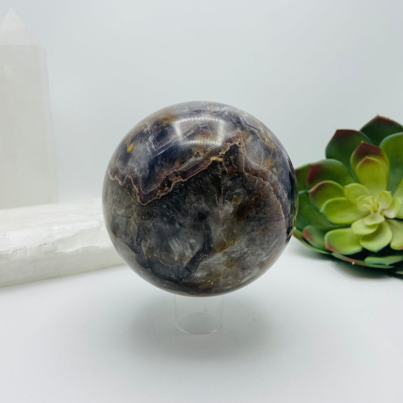 Chevron amethyst sphere with decorations in the background