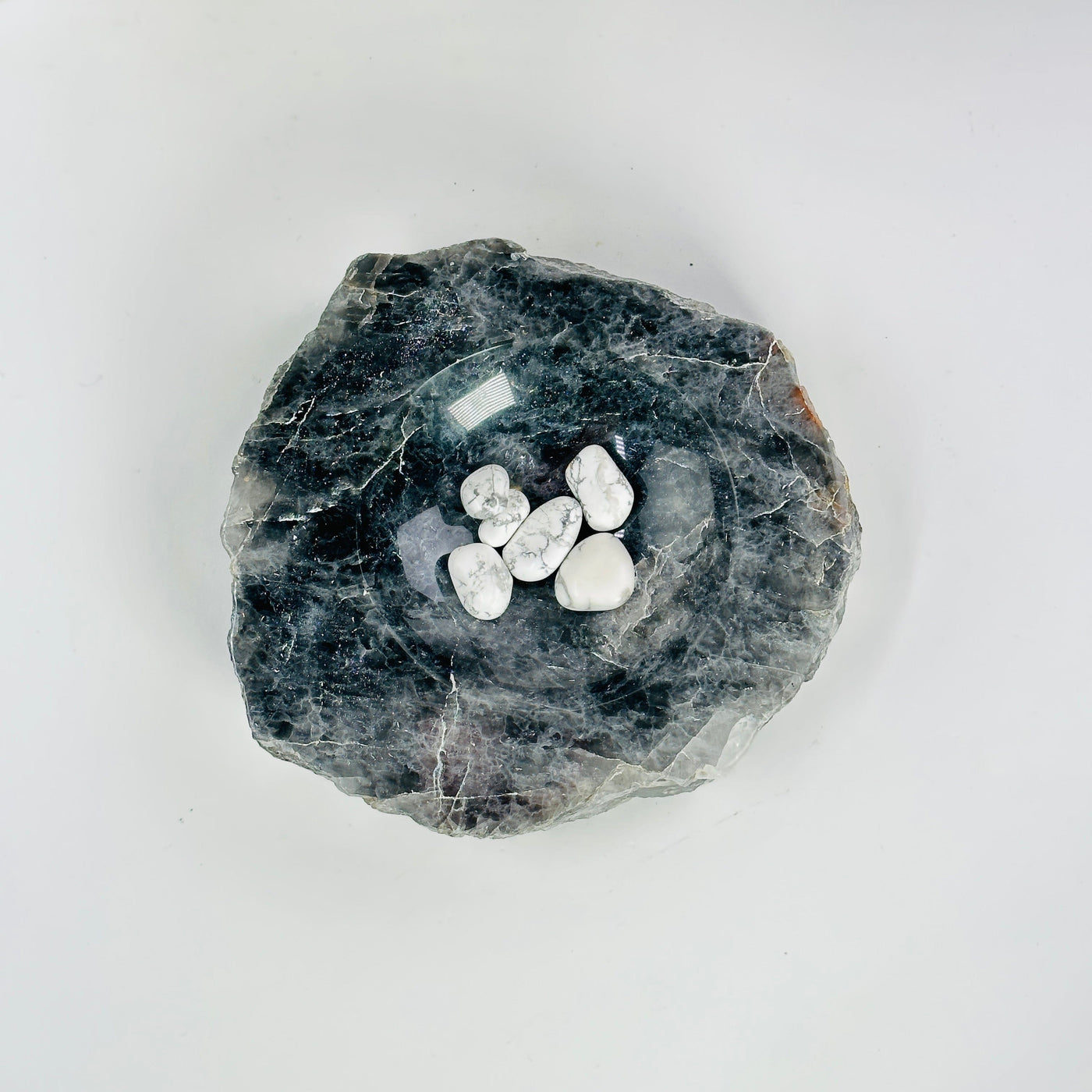top view of larvikite semi polished bowl with stones in it
