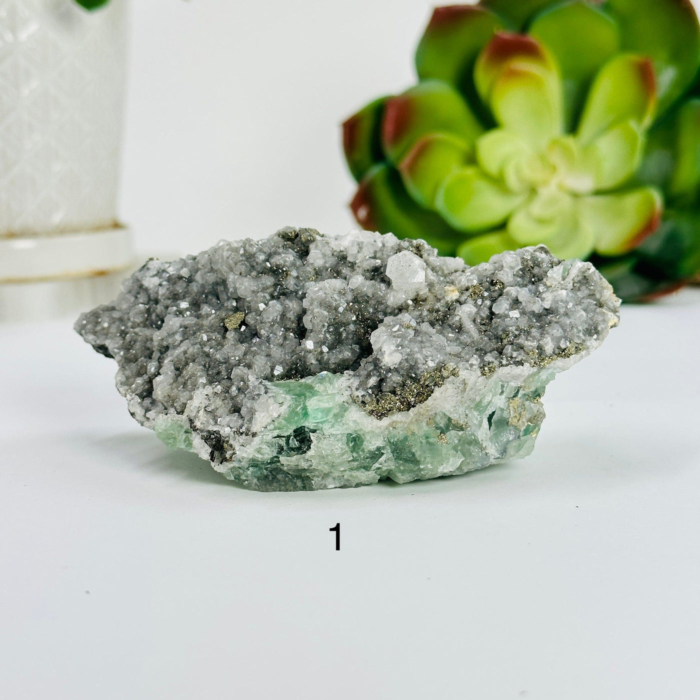variant 1 of fluorite with pyrite and crystal quartz growth with decorations in the background