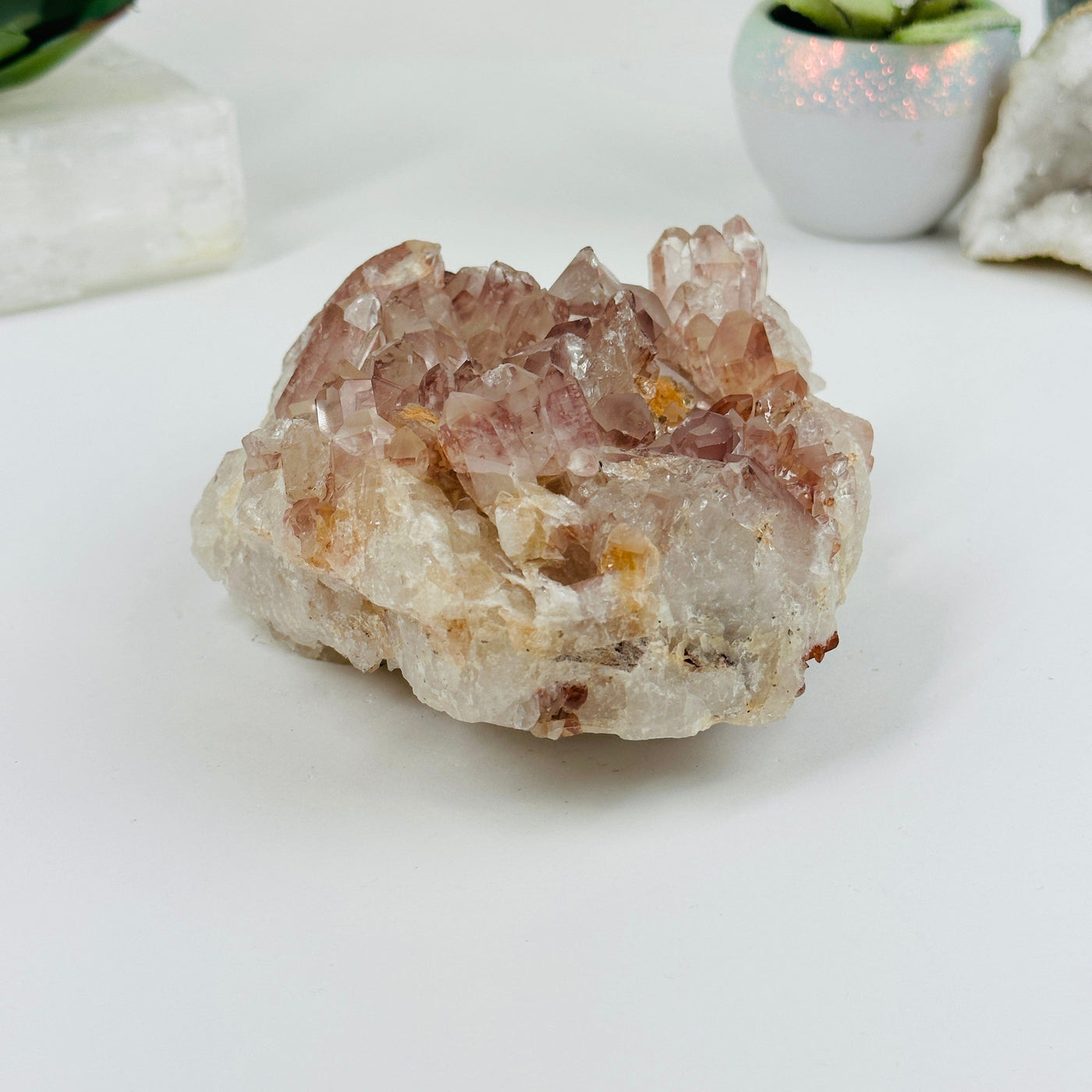 lithium quartz formation with decorations in the background