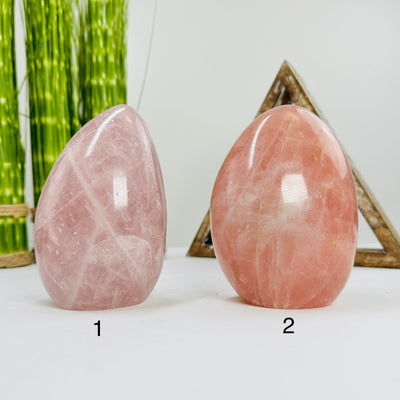 rose quartz polished cutbases with decorations in the background