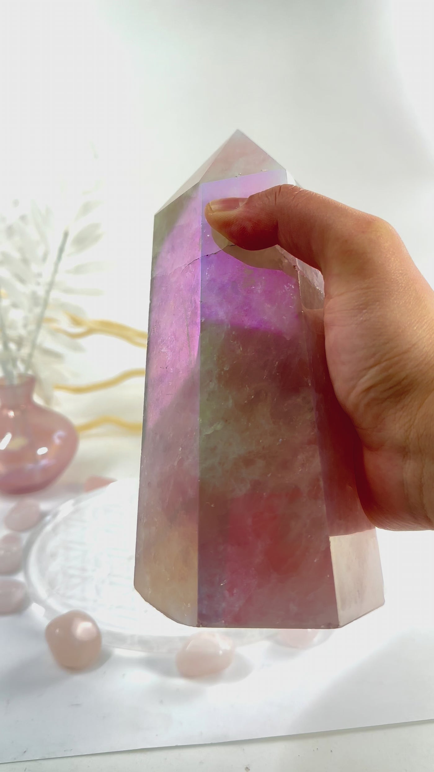 Angel Aura Rose Quartz Polished Point with Natural Inclusions video in hand to show iridescence