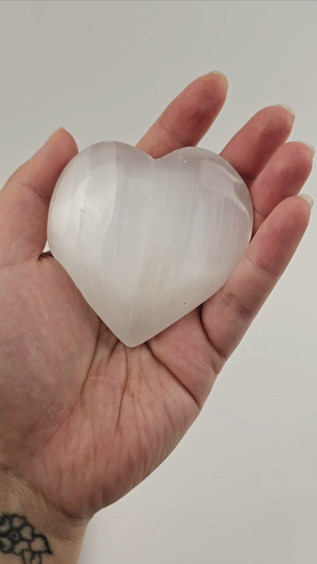 Selenite Crystal Heart - 9 cm video showing gleam and thickness of hearts