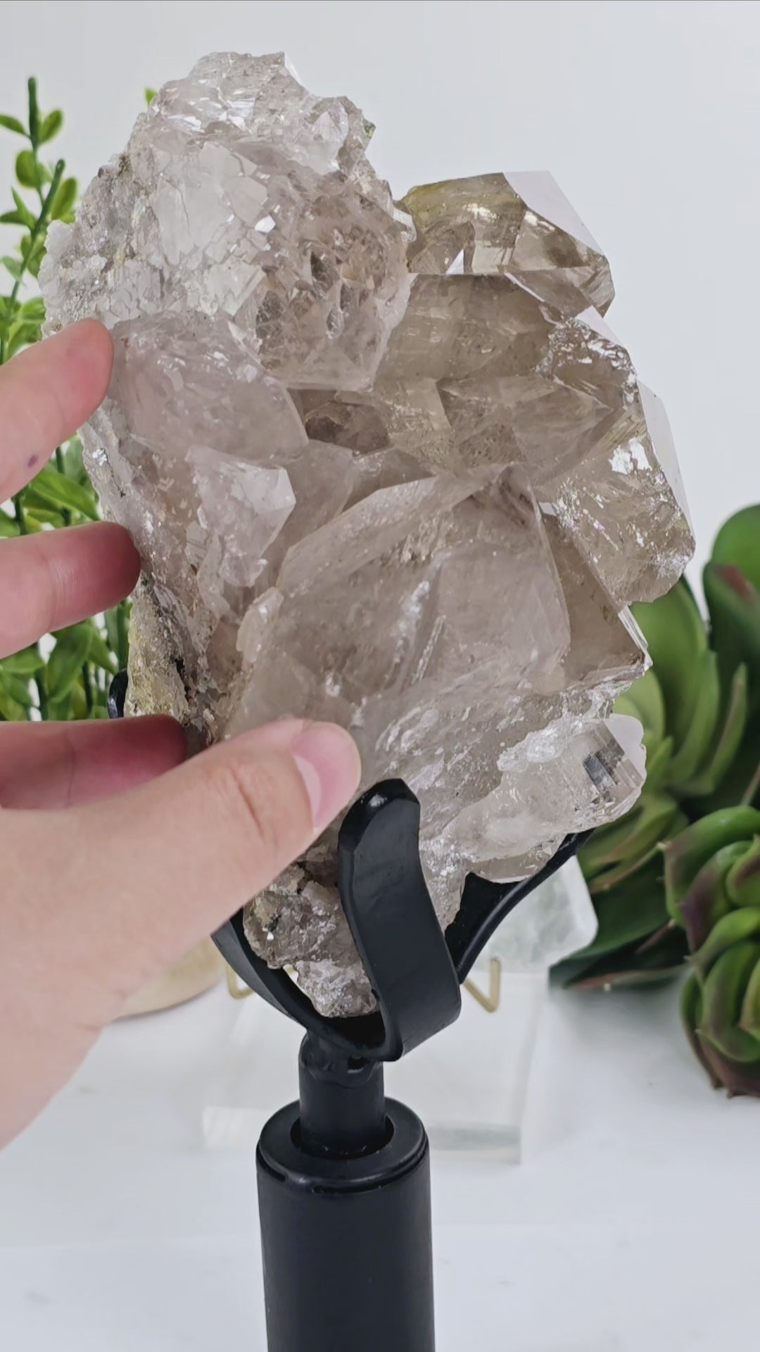 Rutilated Natural Smokey Citrine Crystal Cluster on Rotating Stand video showing it spinning to display all angles