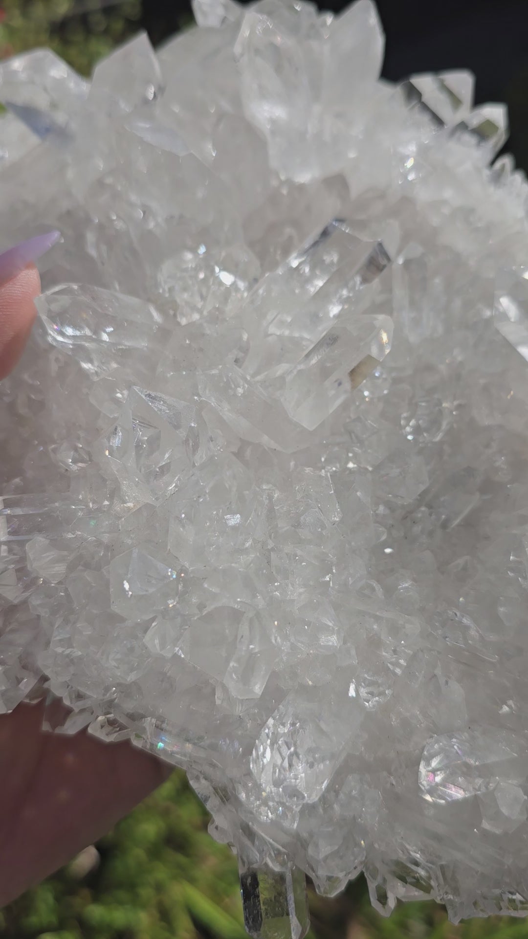 Crystal Quartz Cluster - AA Grade #2 video in hand for size reference moving the crystal to show sparkle