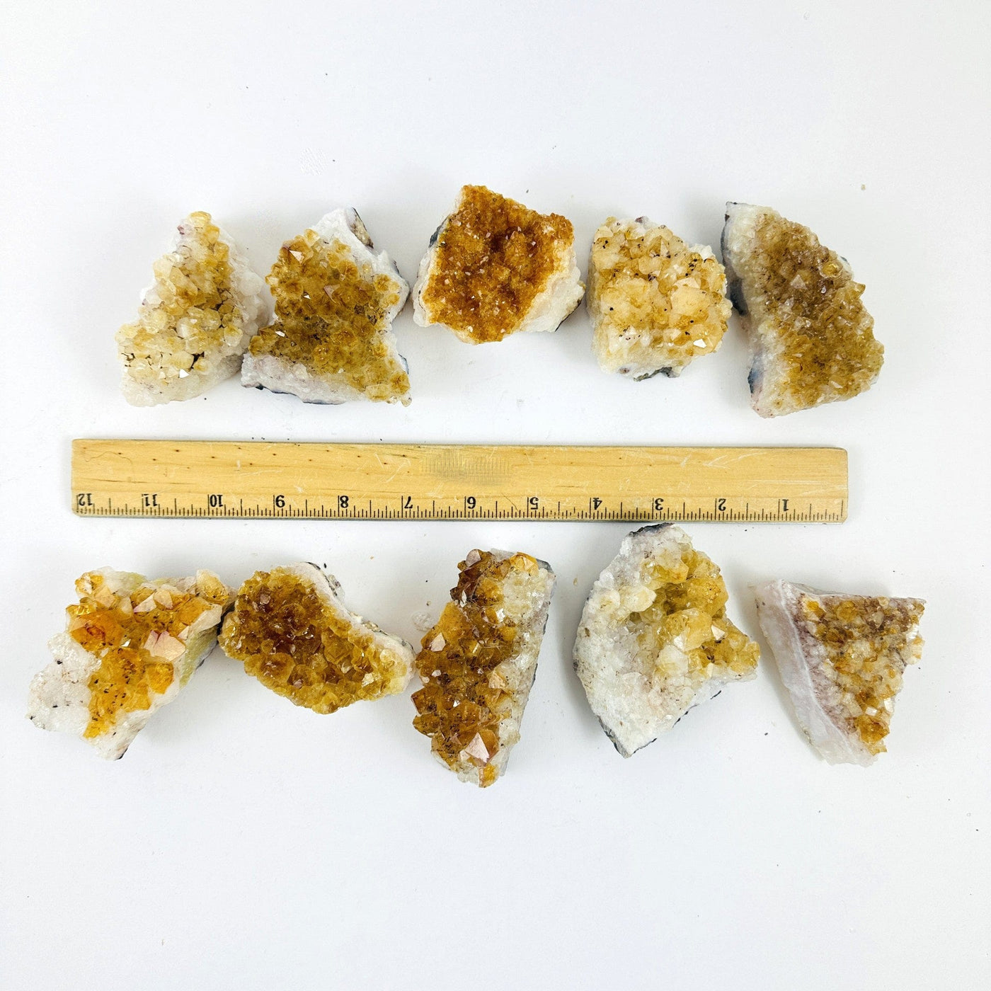 Citrine Crystal Clusters next to a ruler for size reference