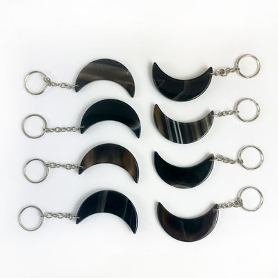 Crescent Moon Agate Key Chains in dyed black color showing variation