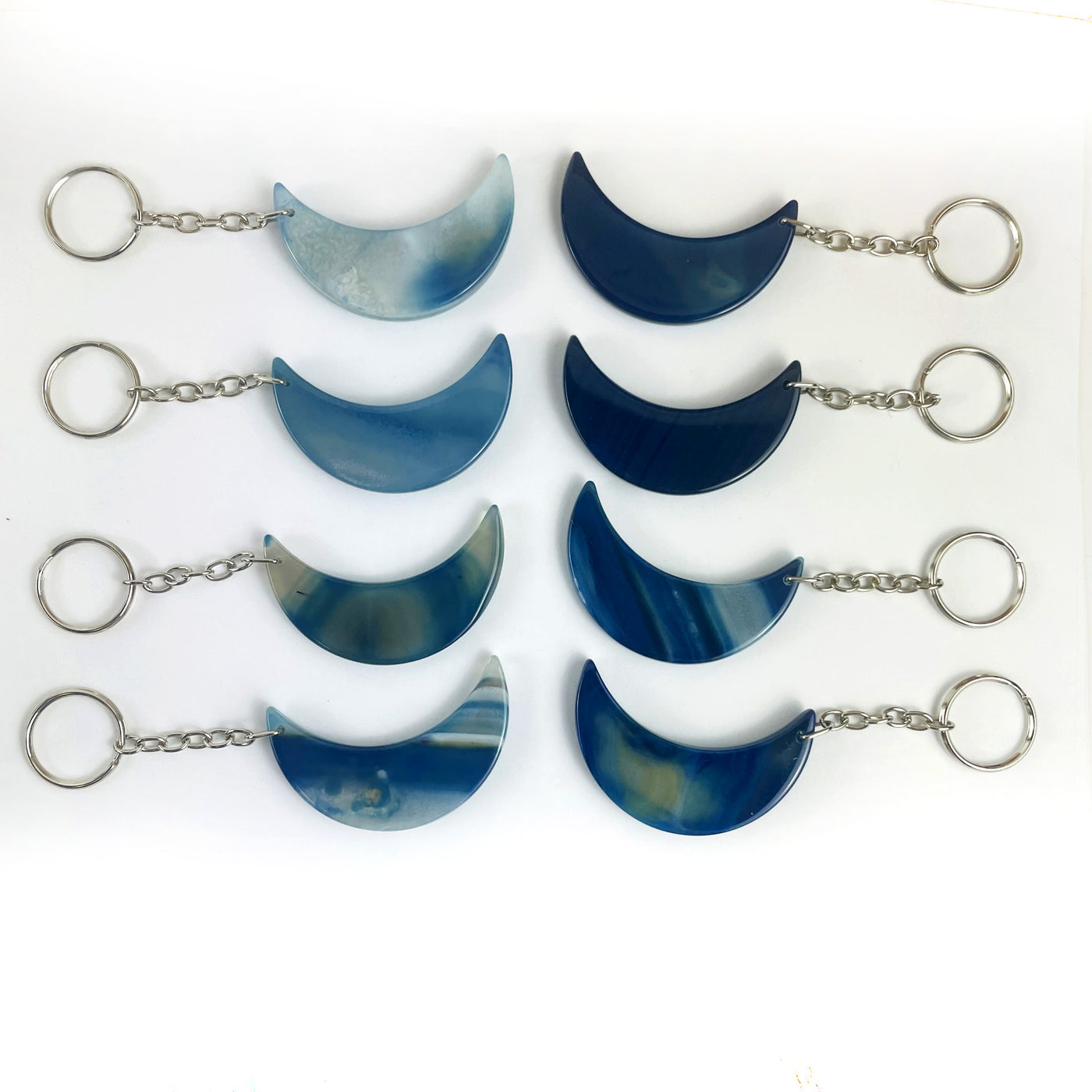 Crescent Moon Agate Key Chains in dyed blue color showing variation