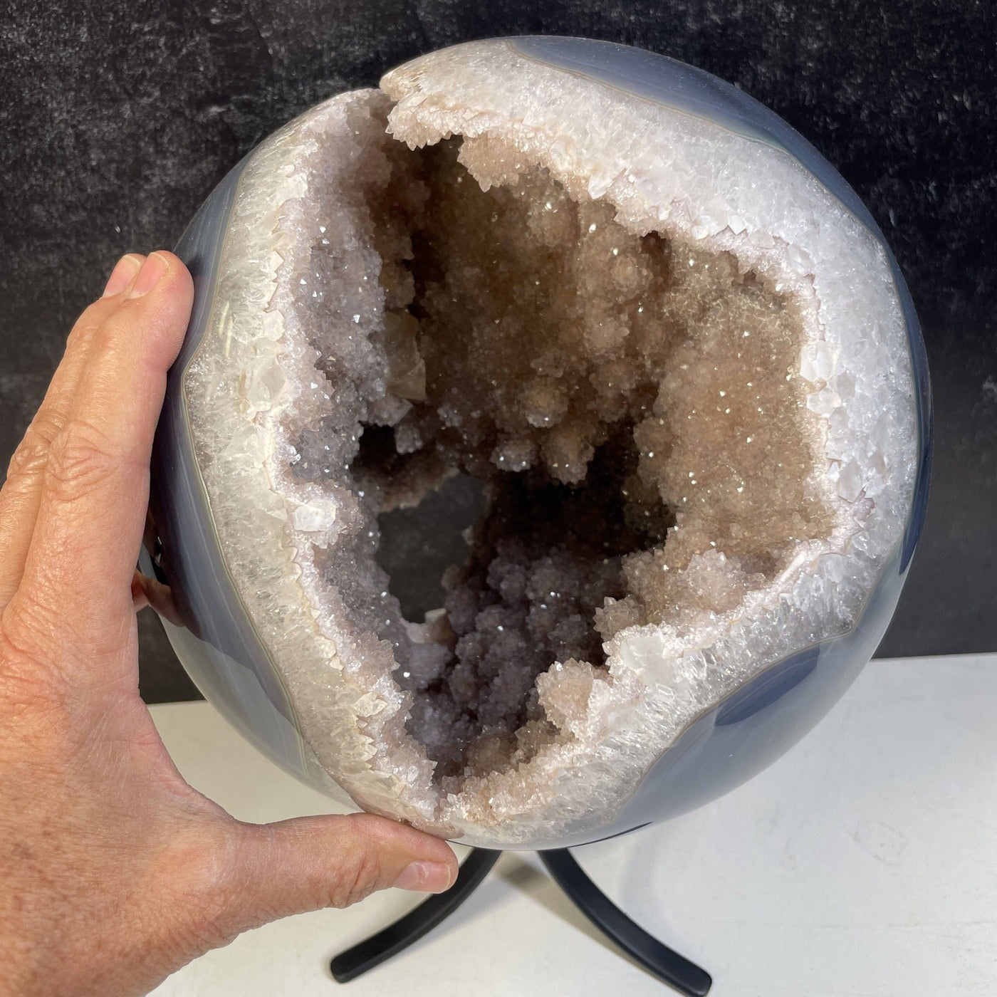 Amethyst Druzy Sphere Polished Crystal with a hand for reference to size