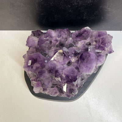 Amethyst Crystal Cluster on Wooden Base shot from above looking down