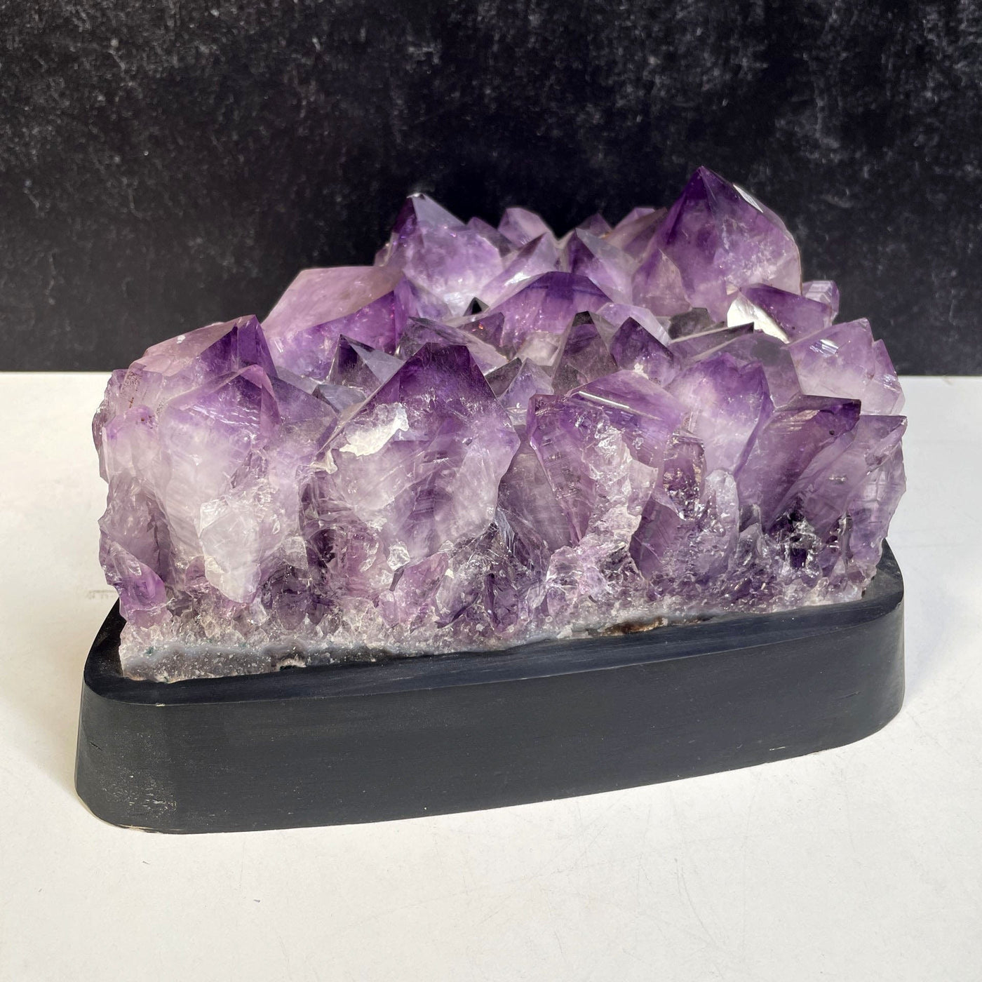 Amethyst Crystal Cluster on Wooden Base a side angle