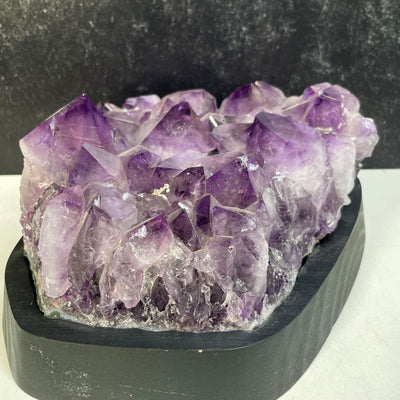 Amethyst Crystal Cluster on Wooden Base a side angle