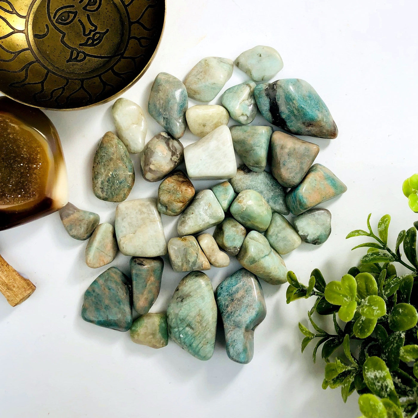 Tumbled stones displayed on a white background.
