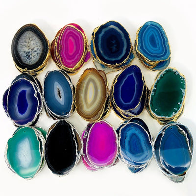 This Picture is showing all the variety of colors we have available for our, agate slices plated edge top drilled.