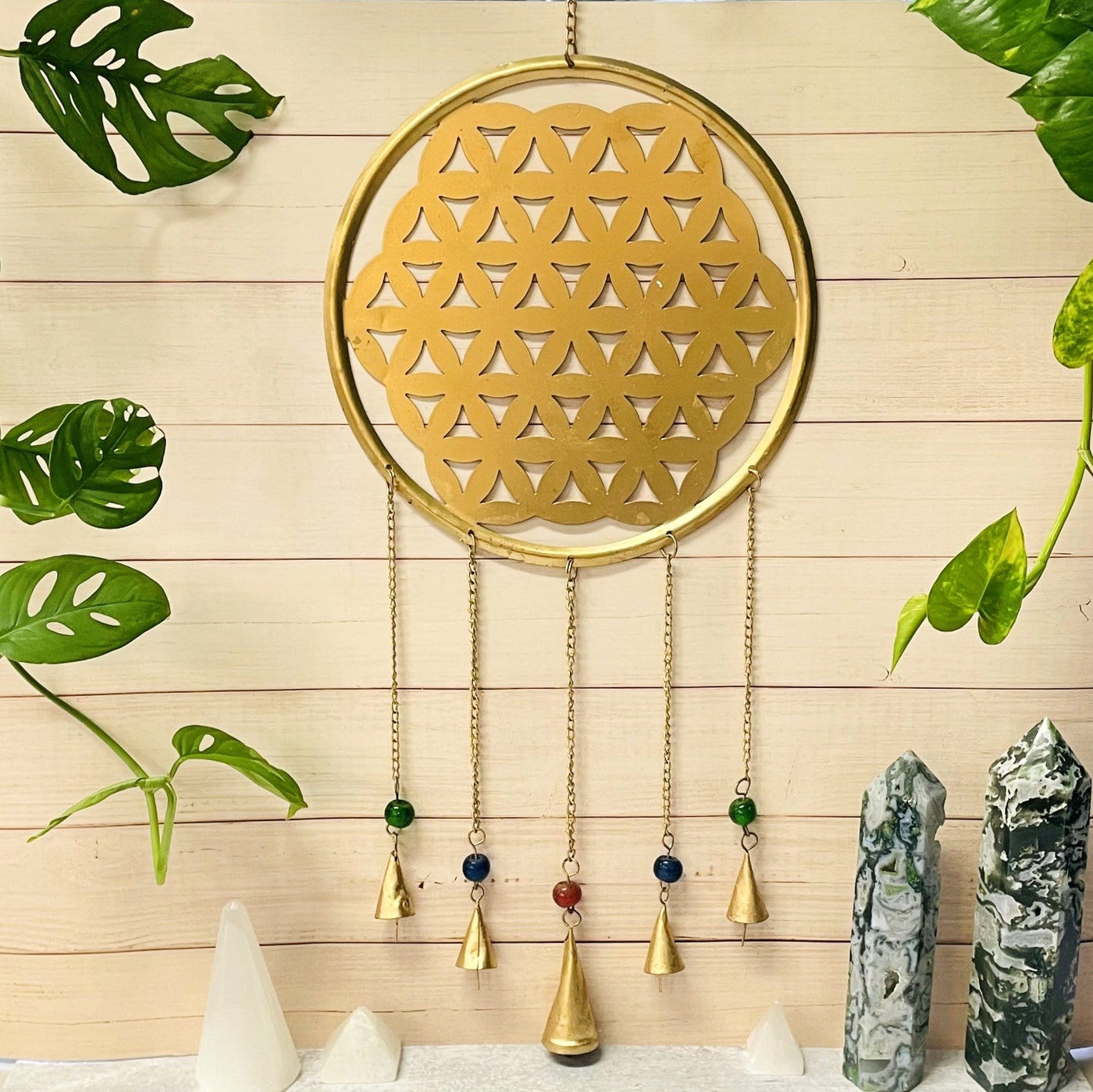 Brass Flower of Life wall Hanging - hanging on a wall
