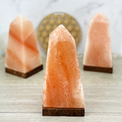 multiple himalayan salt lamps displayed to show the differences in the color shades 