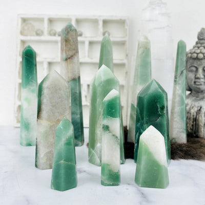 Green and White Quartz Polished Points--front shot of different sizes and tones.