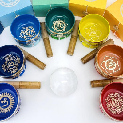 Brass Tibetan Chakra Singing Bowls laid out in an arch shot from above showing design inside