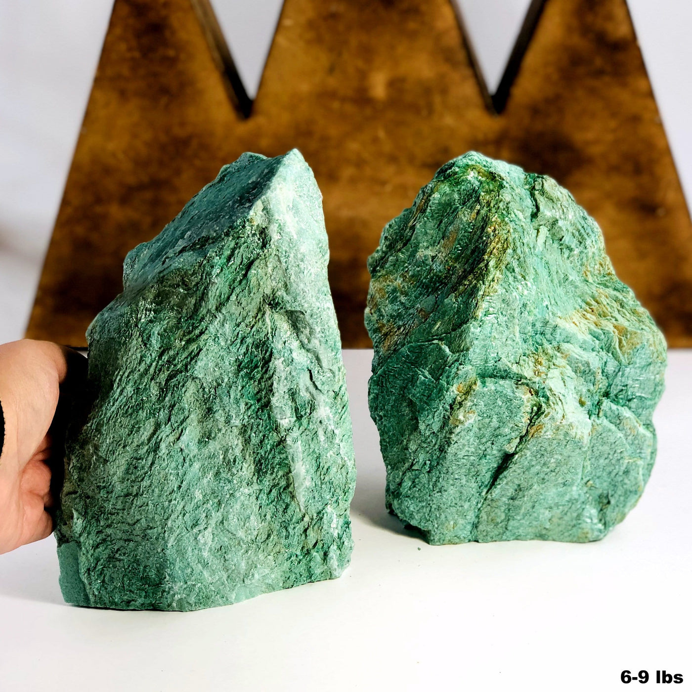 fuchsite cut bases with decorations in the background
