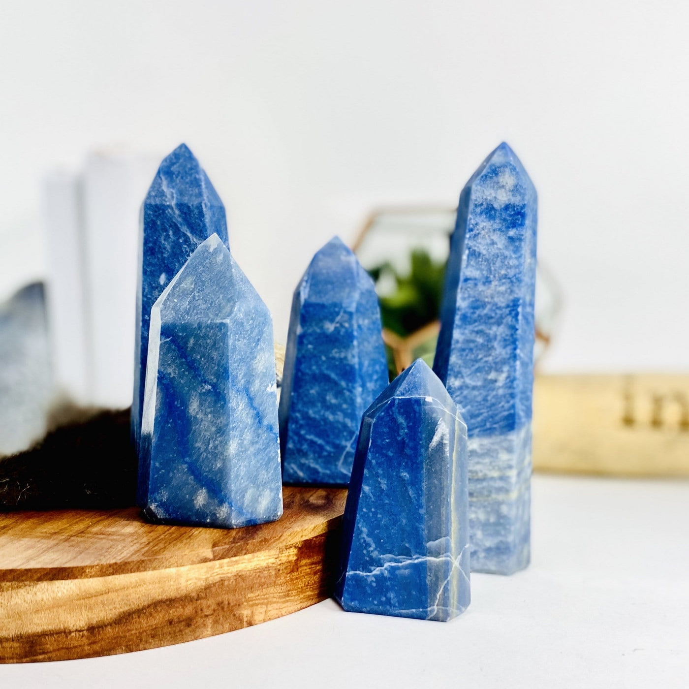 Five Blue Quartz Tower Points front view in a variety of sizes