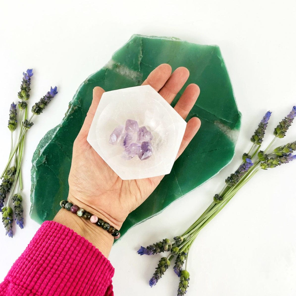 10 cm hexagon selenite bowl in hand for size reference