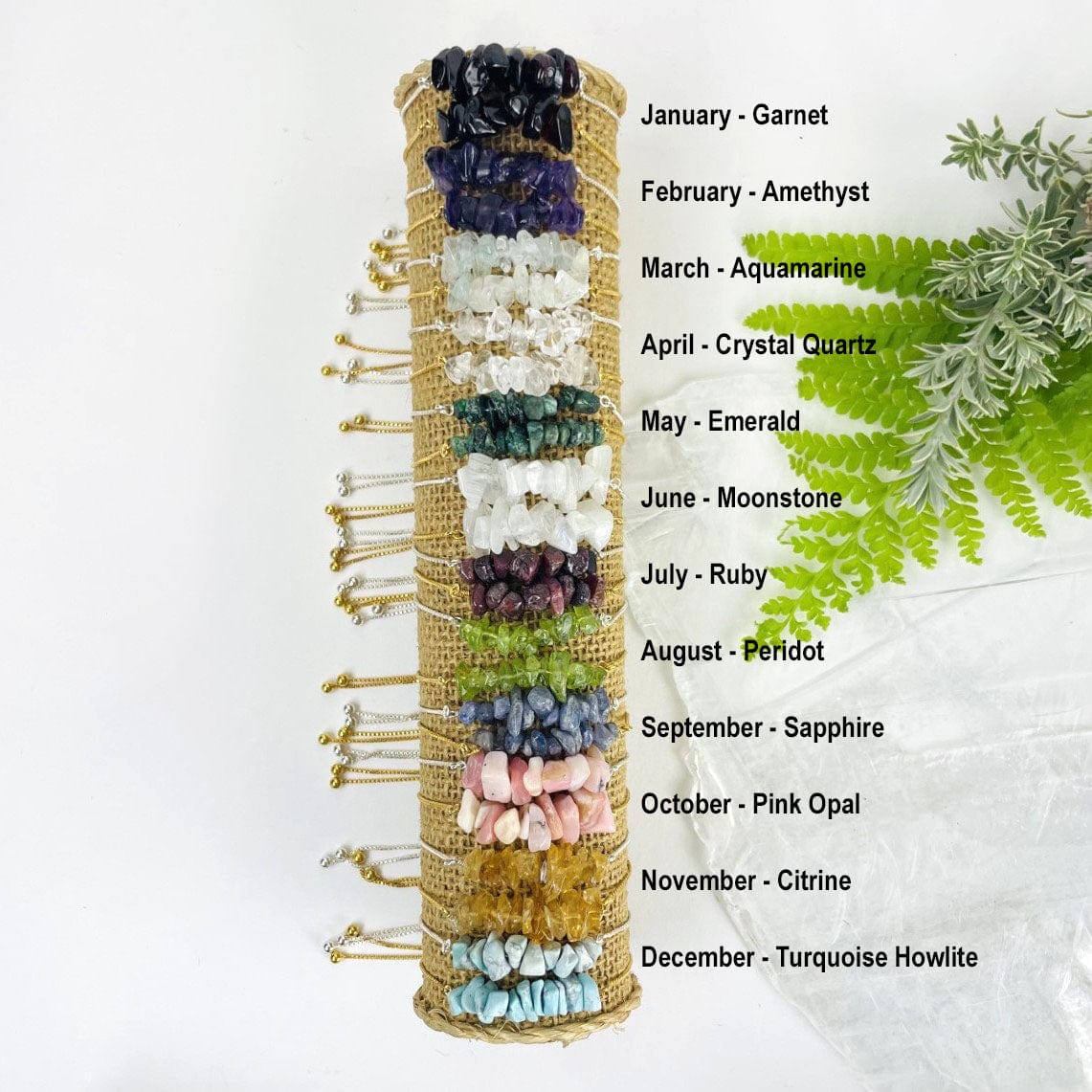 all Stone Bracelets -  Birthstones - Gold over Sterling or Sterling Silver Adjustable Length stacked on a holder with birthmonths called out