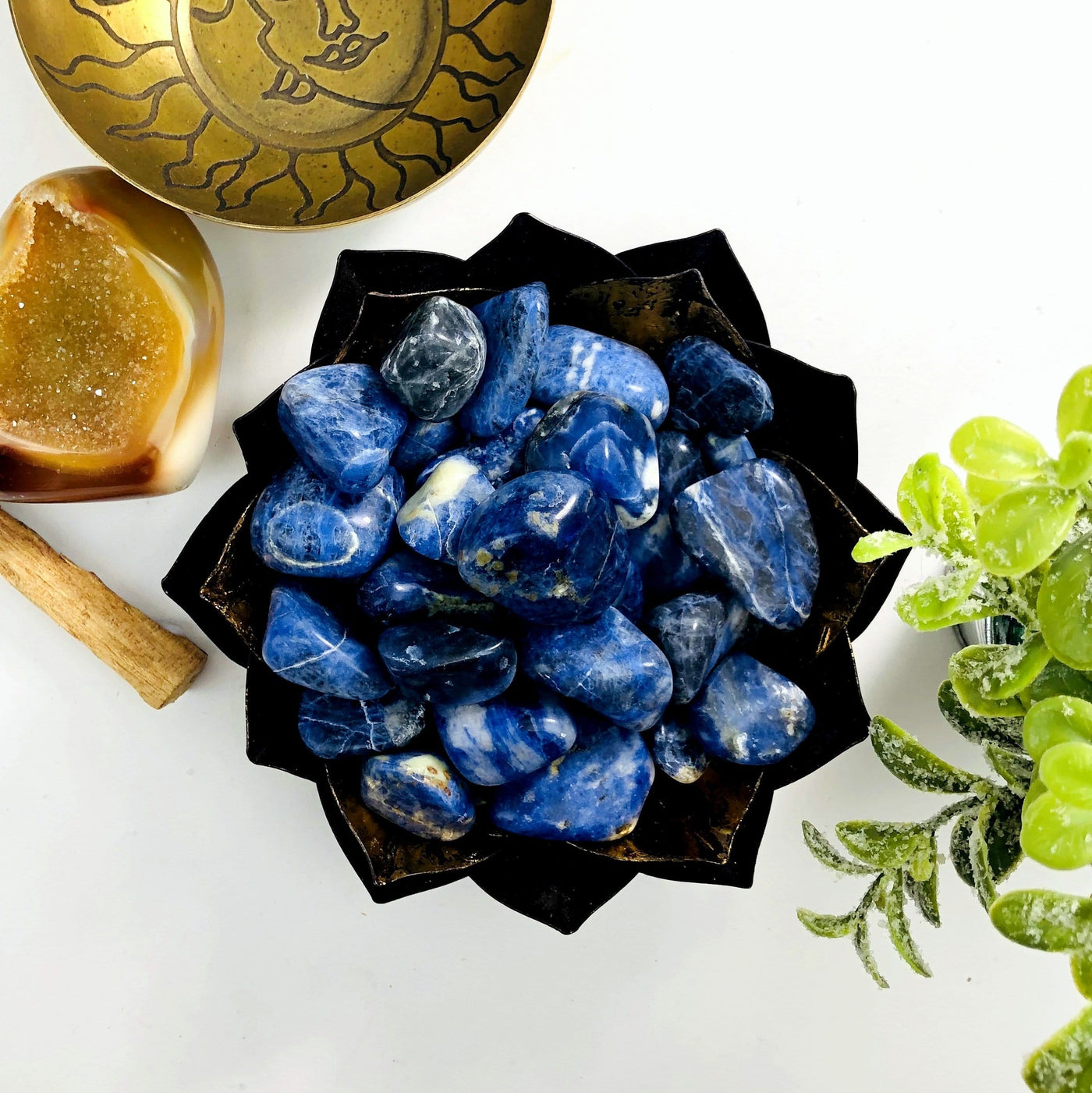 Blue Sodalite Tumbled Gemstones in a gold bowl