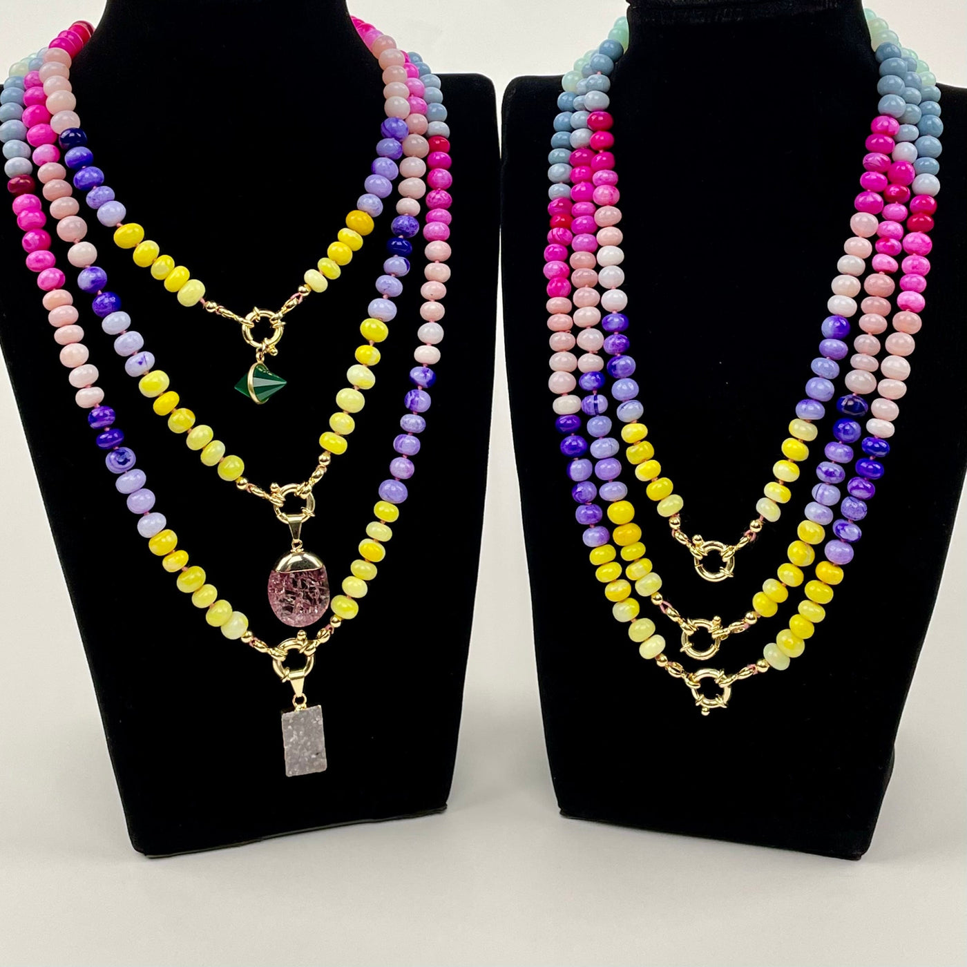 rainbow opal necklaces displayed with candy charms 