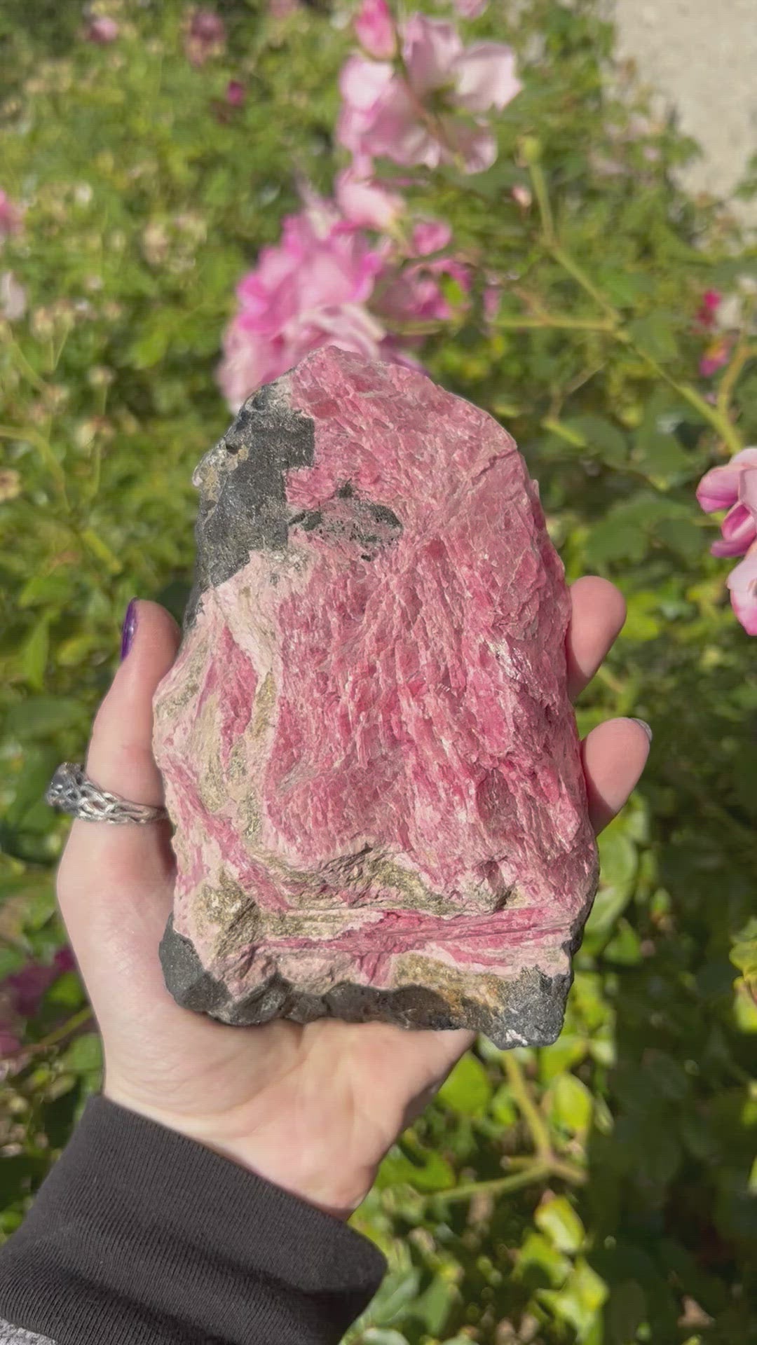 Natural Rhodonite - in a hand